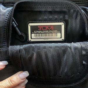 Tumi black leather messenger bag